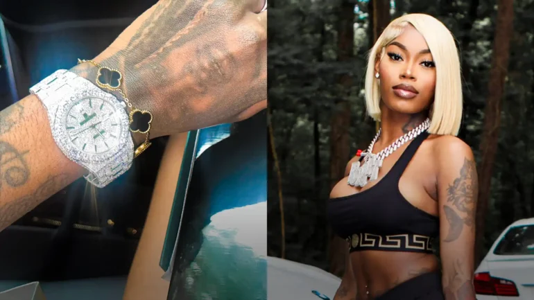 Asian Da Brat holding up new jewelry from her record label