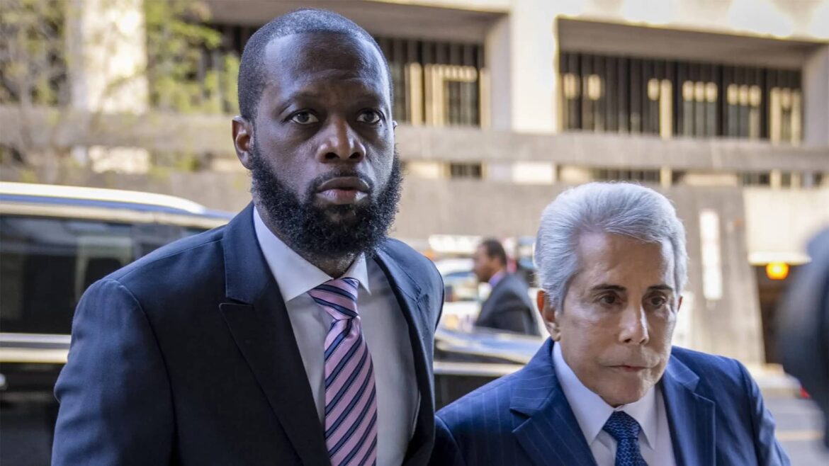 Pras Michel and defense lawyer David Kenner arriving at federal court