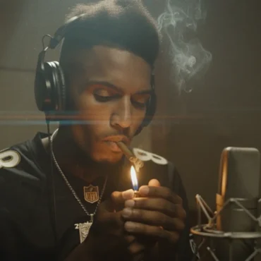 Rich Dunk recording in studio lighting a blunt.