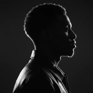 Cinematic studio portrait of rapper Haydeezy featuring a split composition with a close-up and full-body shot in a black leather jacket.