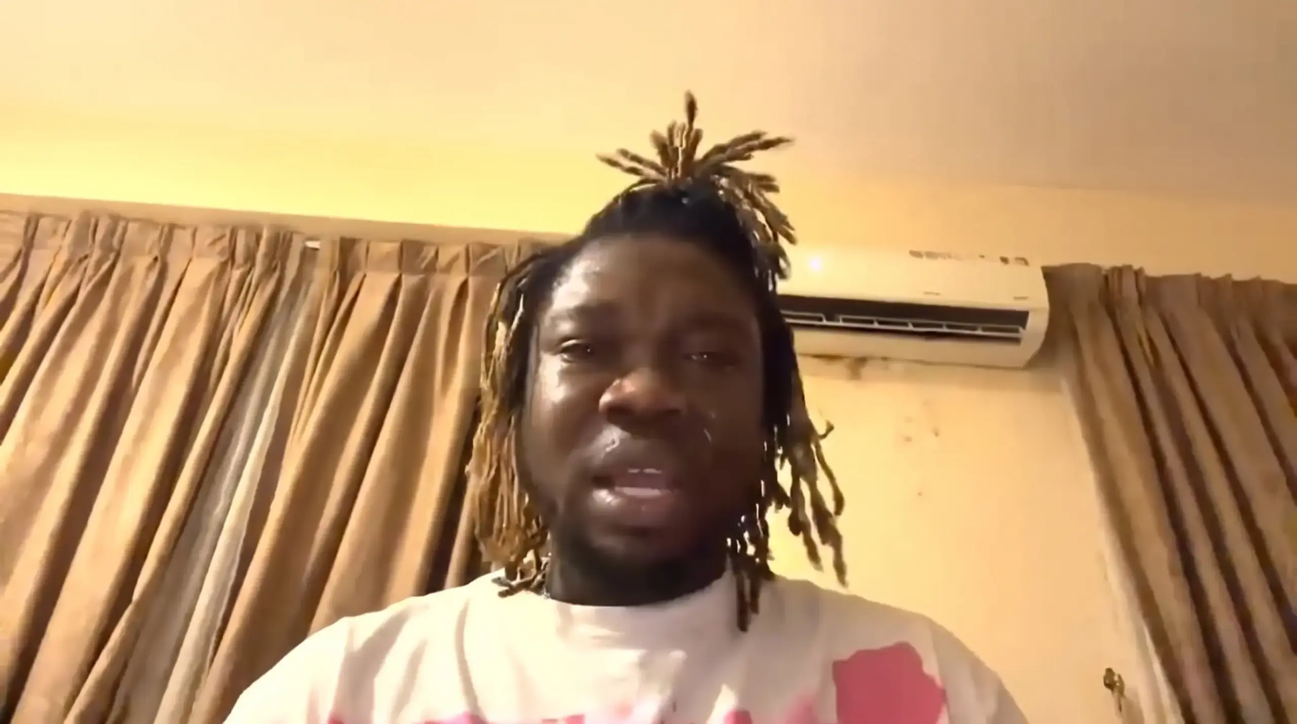 Man cries to the camera in a still from the viral video
